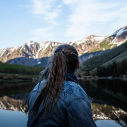 a woman looking at mountains
