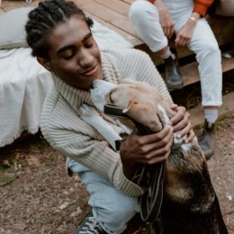 a man hugging his dog