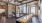 a room with a pool table and chairs