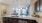 a kitchen with a marble countertop